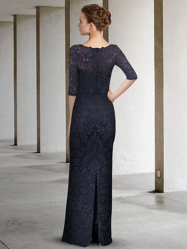 Back view of woman in elegant A-line mother of the bride dress, highlighting the pleated chiffon skirt.