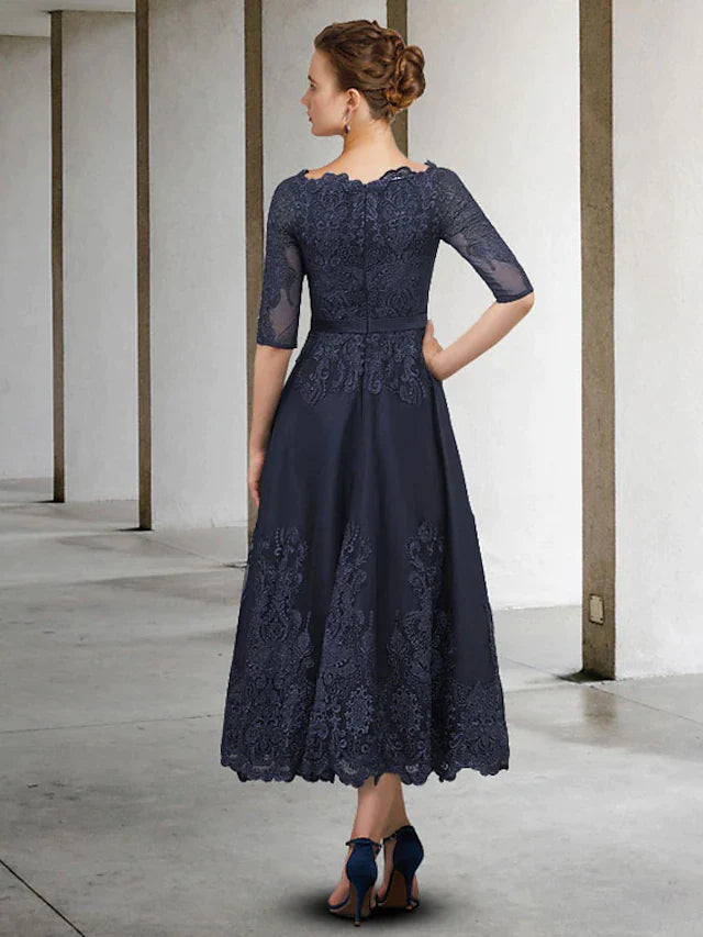 Side view of the A-Line Mother of the Bride dress, showing lace tulle appliques and half sleeves.
