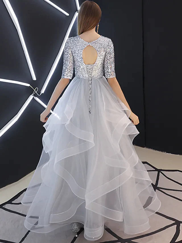 Back view of the A-line jewel neck sequin tulle bridesmaid gown.