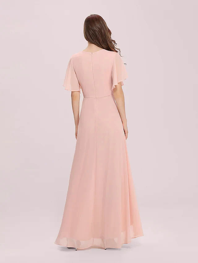 Model in a light blue A-line jewel neck chiffon bridesmaid dress with an asymmetrical high-low hem, side view.