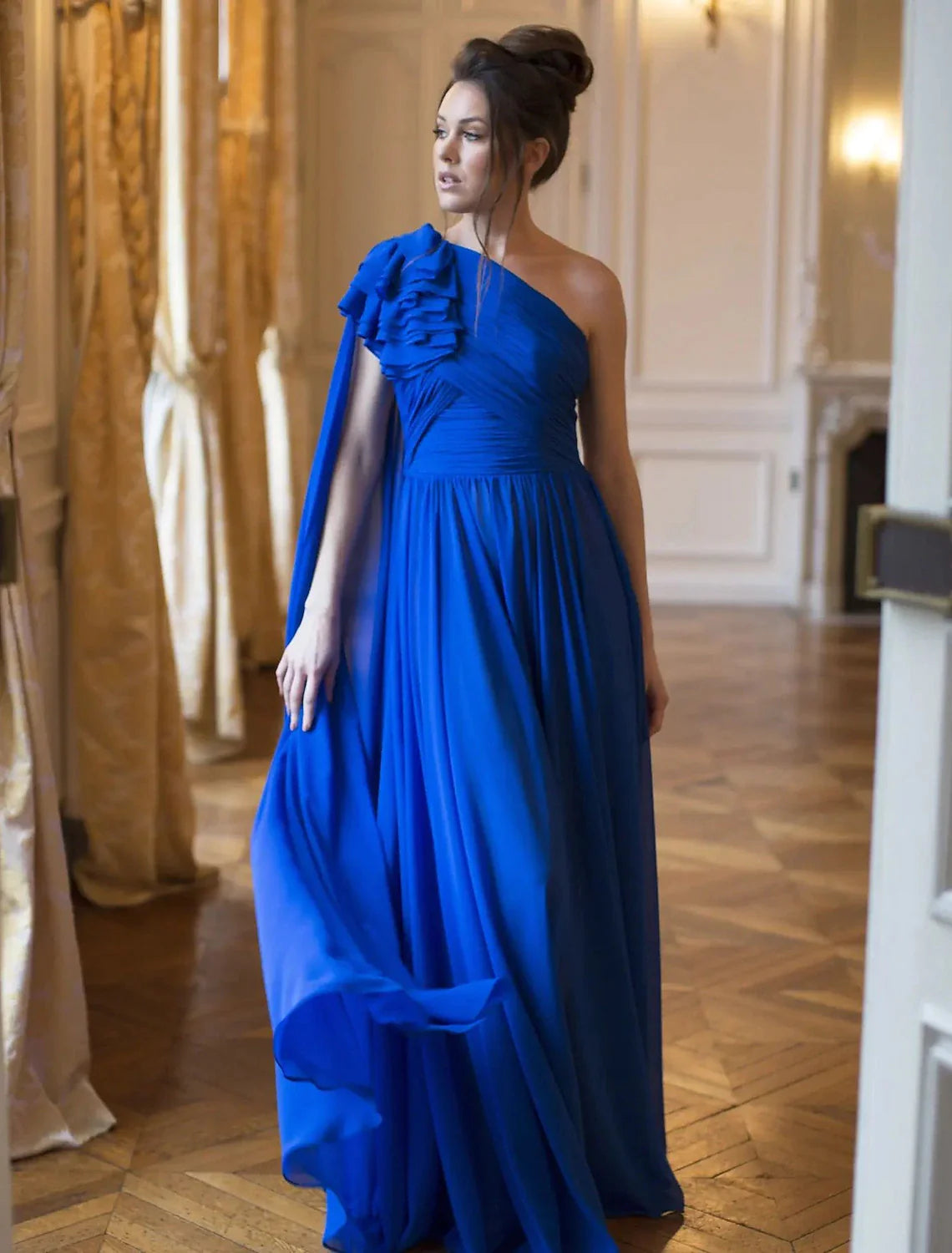 Full view of the back of the elegant A-line one-shoulder chiffon evening gown.