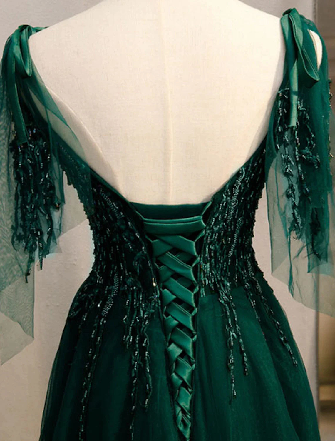 Side view of the elegant A-Line dress, highlighting its silhouette and embellishments.