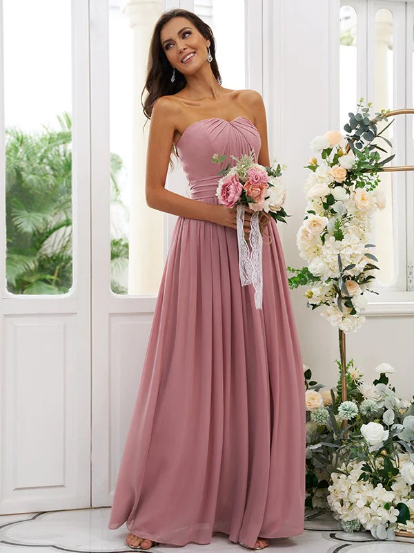 Back view of a floor-length A-line light blue bridesmaid dress with flowing chiffon skirt.
