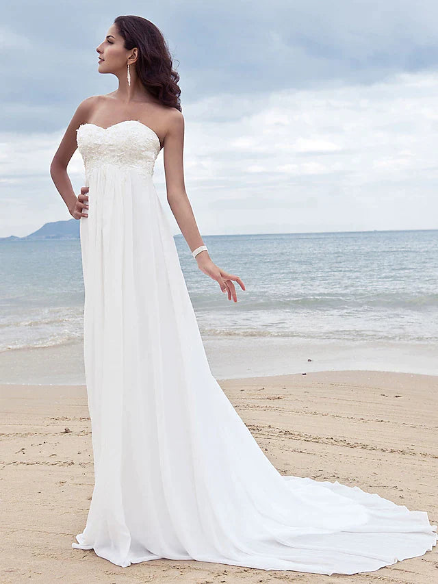 Full length view of the A-line strapless chiffon wedding dress from a different angle.