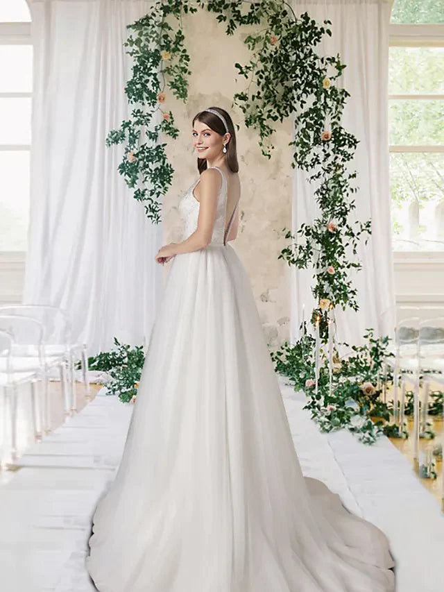 Close-up of the A-Line wedding dress showing V-neck, lace bodice, and sequin embellishments.