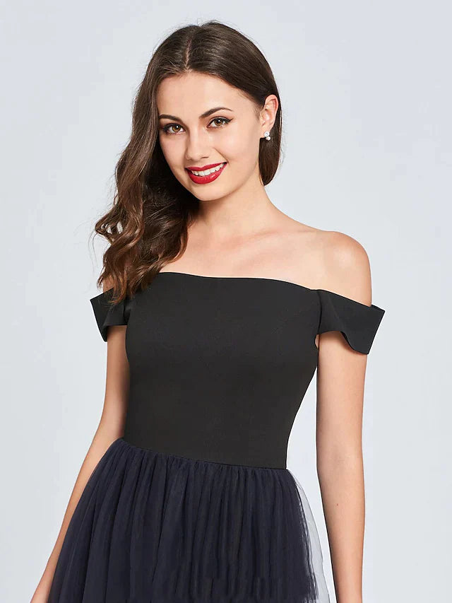 Back view of the off-shoulder pleated tulle mini dress with a flowing skirt.
