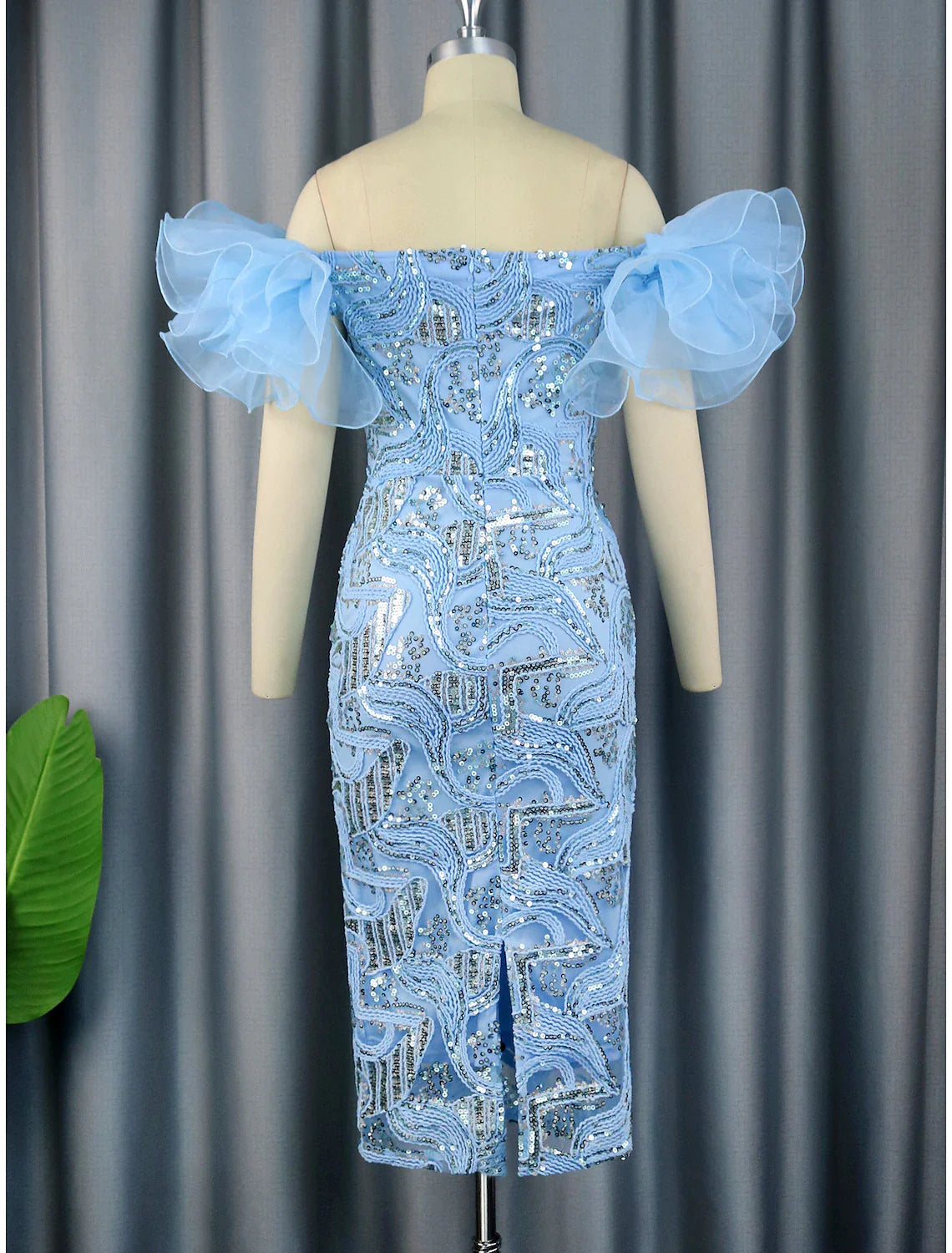 Back view of a model showcasing the sheath column floral sequined dress.