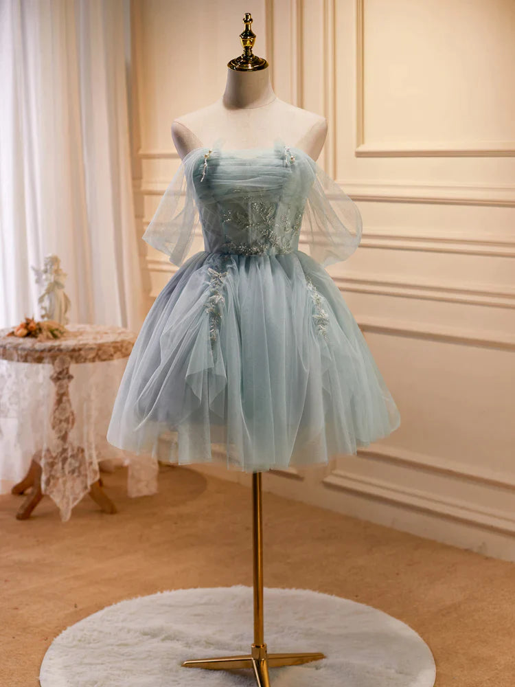 Back view of the light green A-line short prom dress with intricate beading.