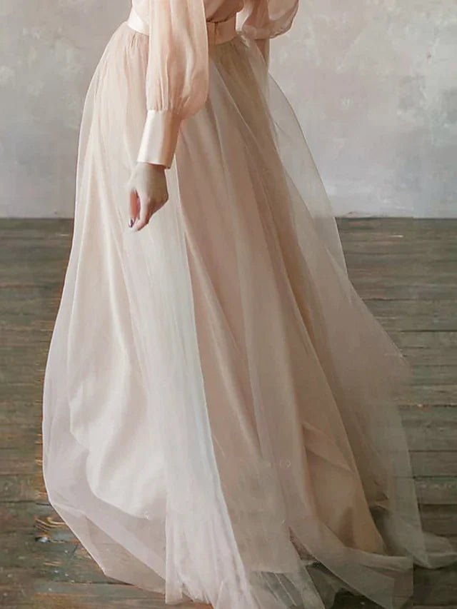 Close-up of the stand collar and long sleeves of the formal dress.