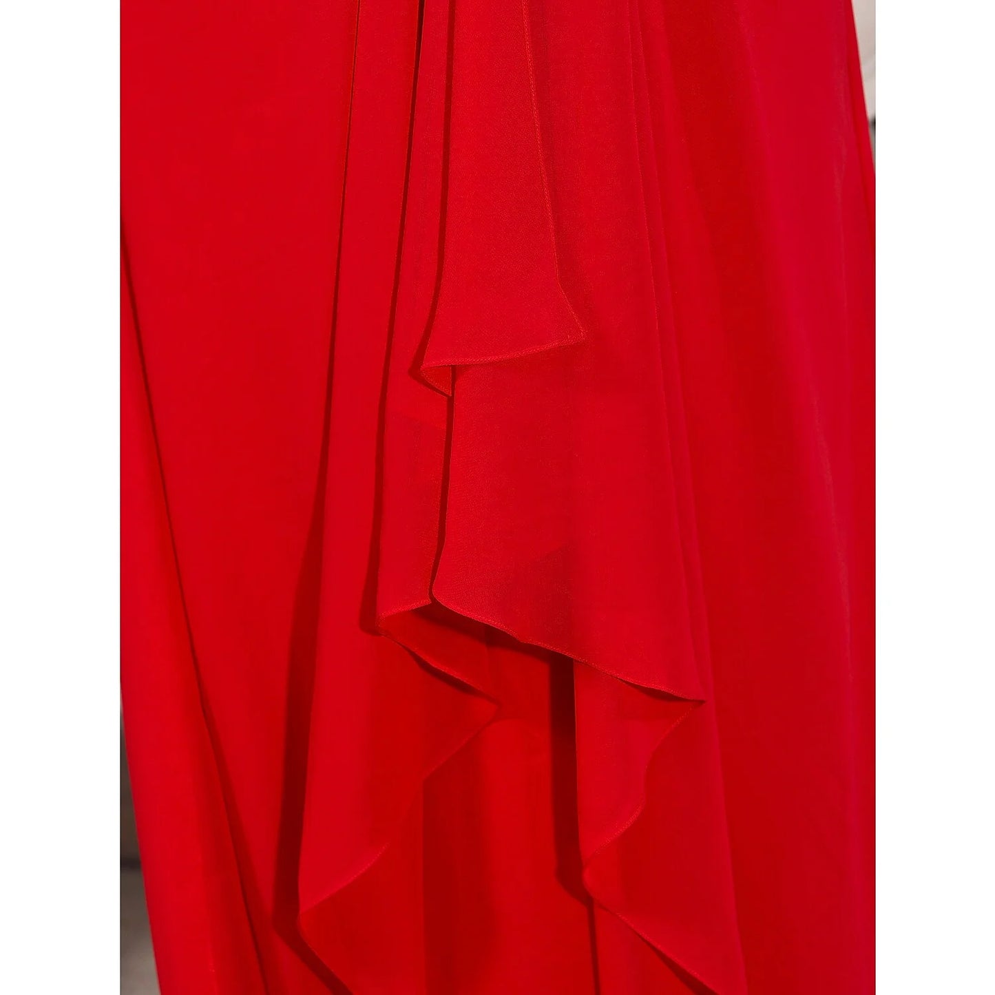 Detail of the plunging neckline and bodice of the beaded chiffon dress.