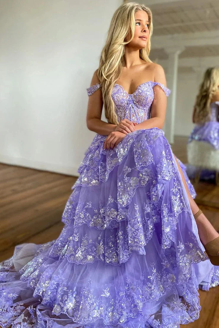Front view of a model in a light blue off-shoulder ball gown prom dress, highlighting the elegant neckline.