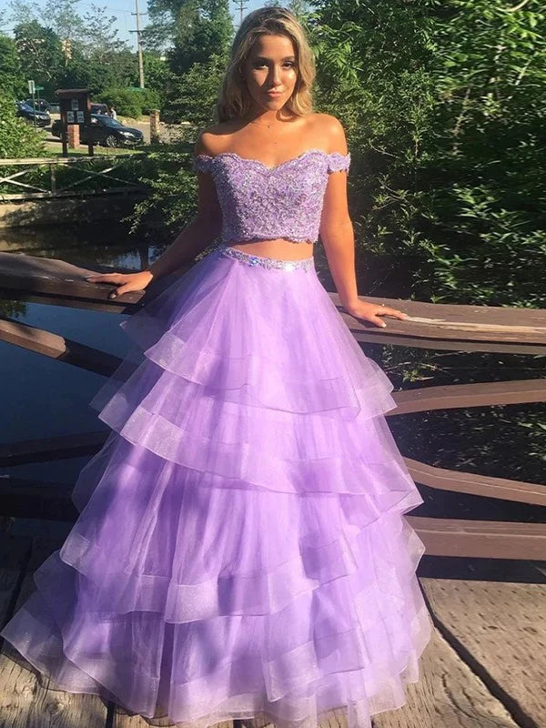 Light blue A-line off-shoulder two-piece prom gown with flowing tulle skirt.