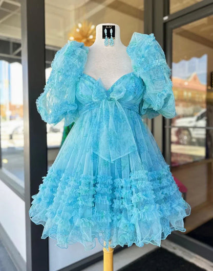 Side profile of a model in a light blue floral A-line mini homecoming dress.