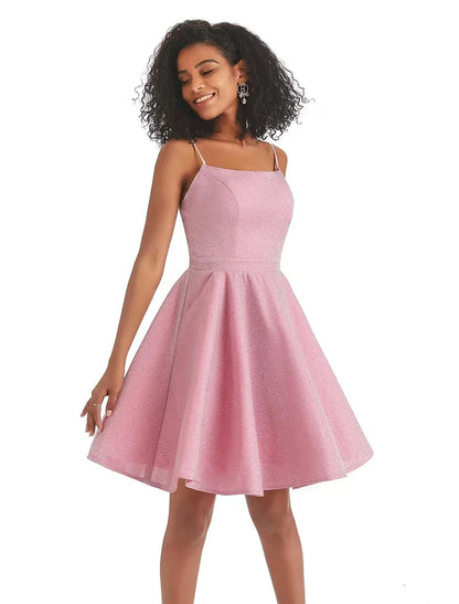 Model posing in a pink A-line backless mini dress, showing the back detail.