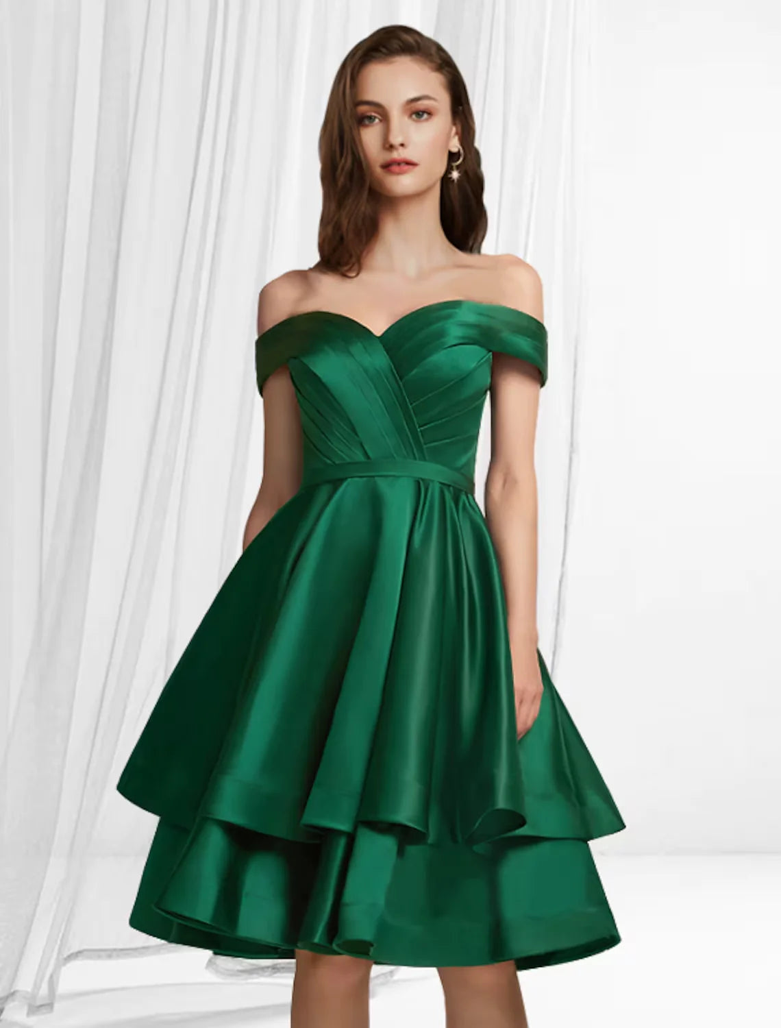 Model wearing an elegant A-Line Empire off-shoulder satin cocktail dress with tiered knee-length skirt.
