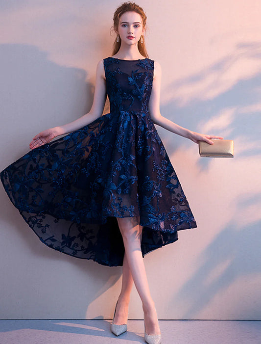 Model wearing an elegant A-line jewel neck tulle cocktail dress with pleats.