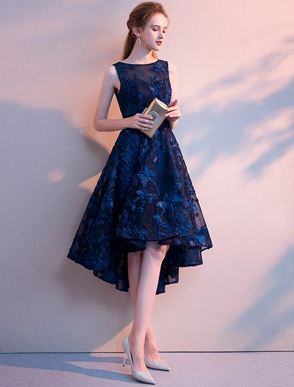 Full length view of the elegant A-line homecoming dress with flowing tulle skirt.