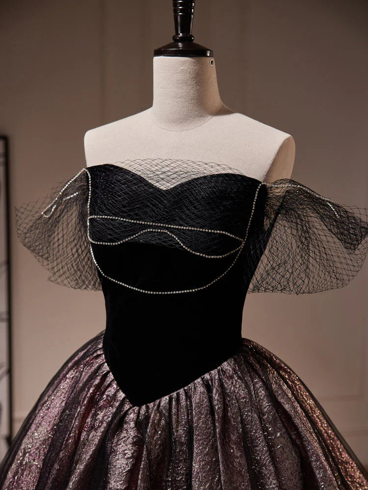 Back view of a model showcasing a black off-shoulder A-line tulle dress.