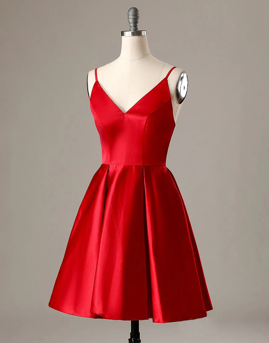 Side view of a red A-line short homecoming dress with spaghetti straps.