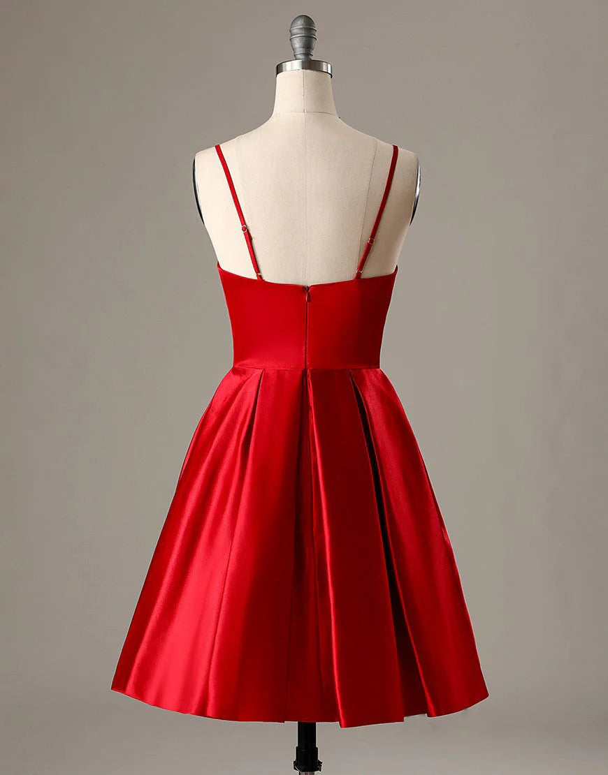 Back view of a red A-line short homecoming dress with spaghetti straps.