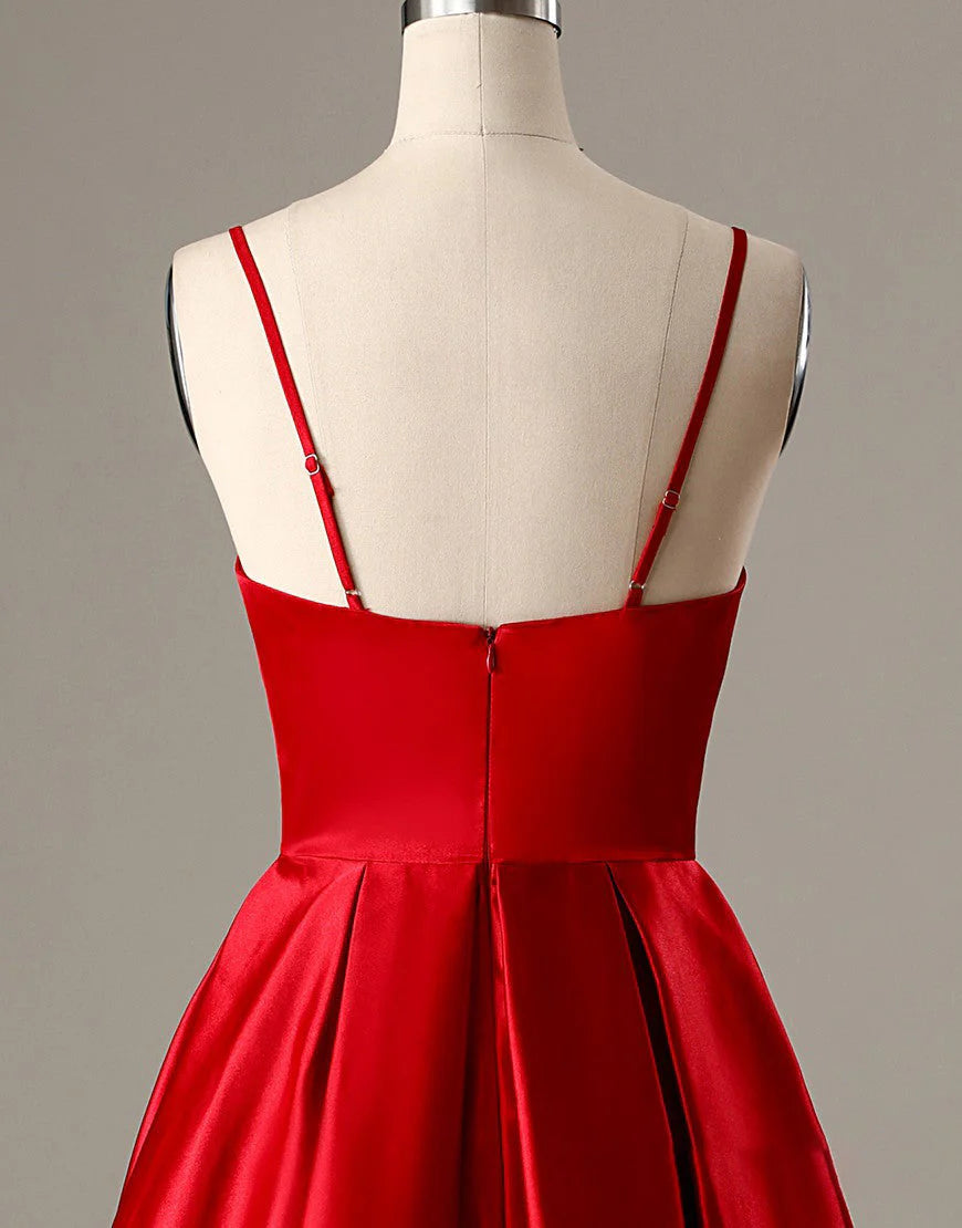 Model showcasing the red A-line short homecoming dress with functional pockets.