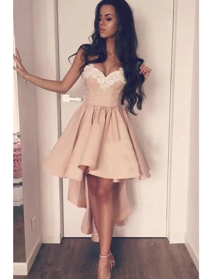 Elegant A-Line sweetheart cocktail dress with appliques and asymmetrical hem.