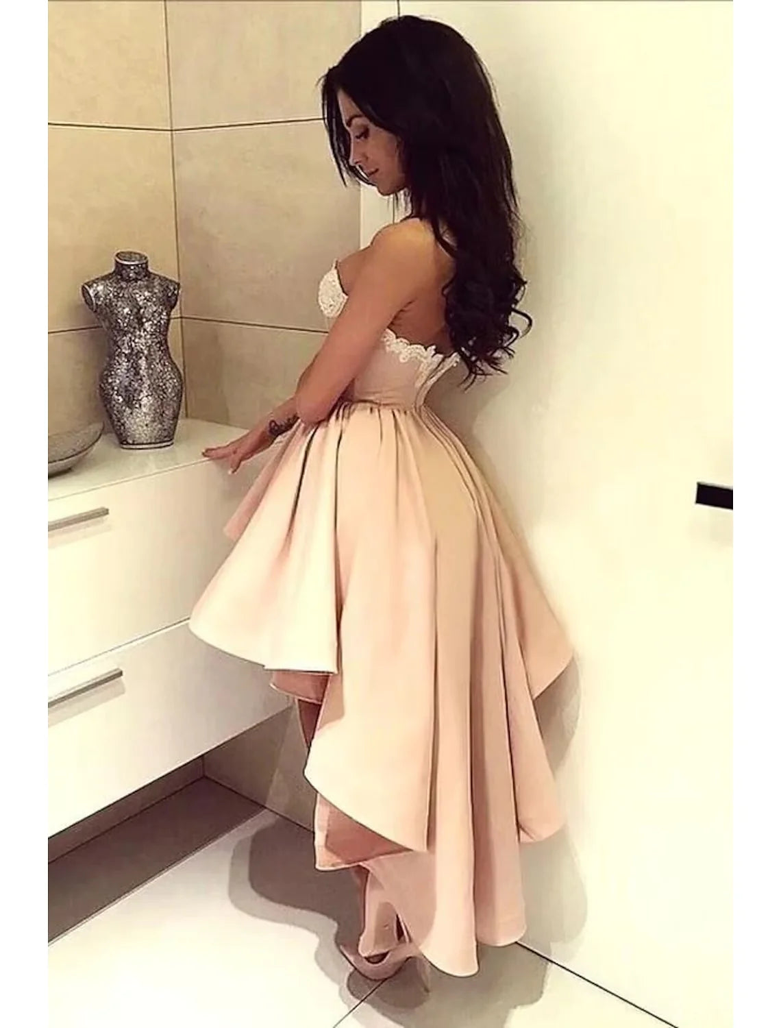 Back view of the satin A-Line dress, showcasing the backless design and appliques.