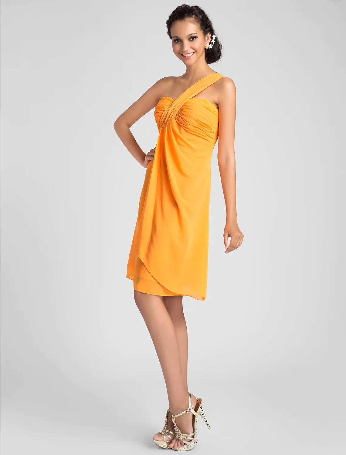 Model wearing a light blue A-line one-shoulder knee-length dress with draped chiffon.