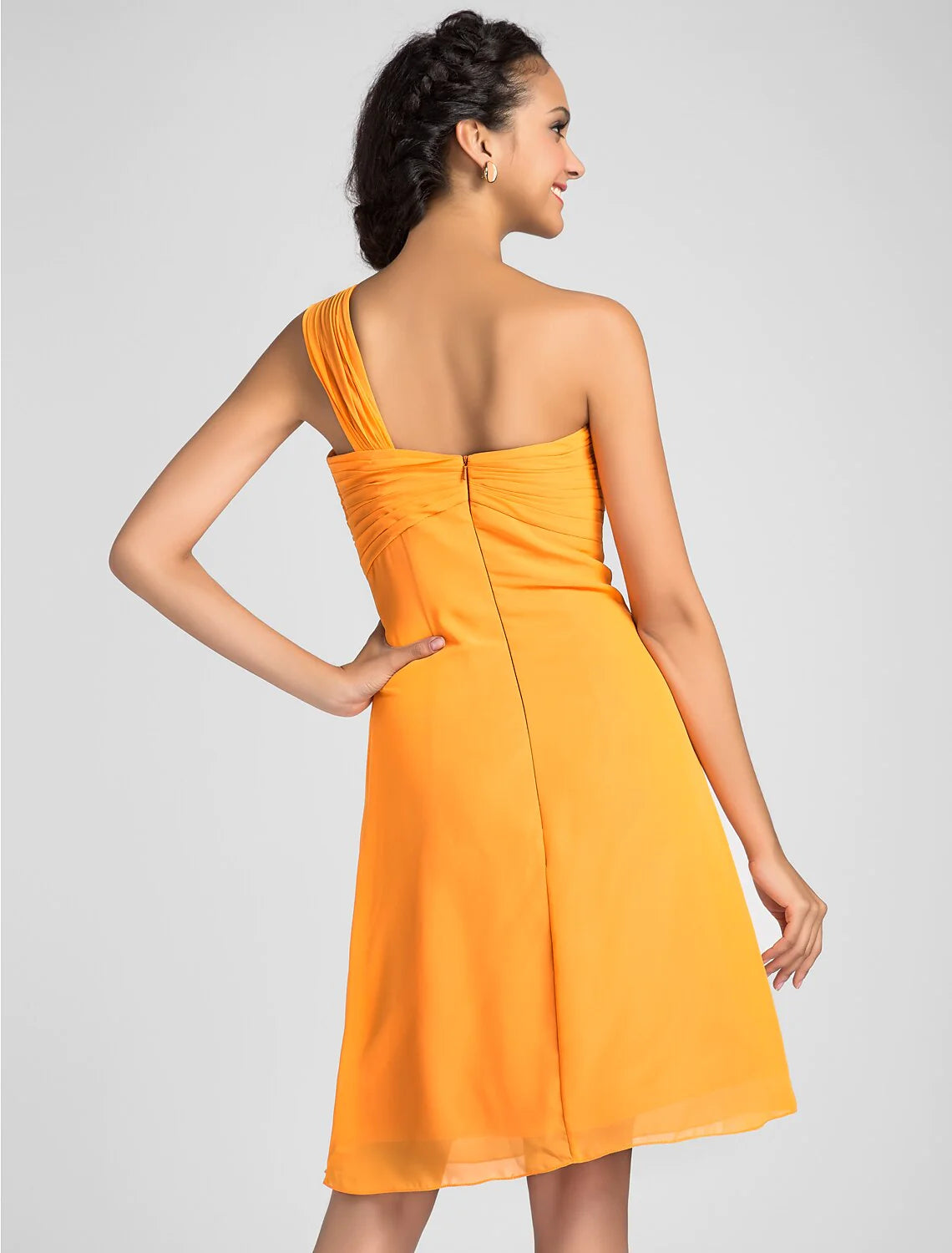 Model in a light blue A-line sweetheart knee-length dress with criss-cross draping.