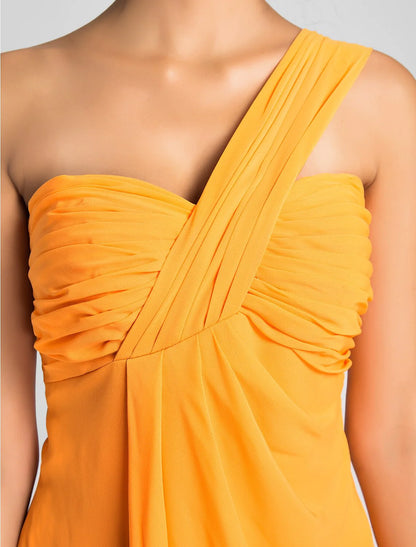 Side view of a model in a light blue A-line one-shoulder knee-length dress.