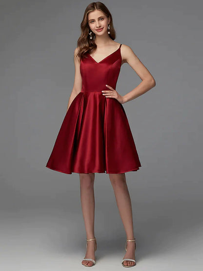Woman wearing a burgundy A-line V-neck pleated satin mini dress.
