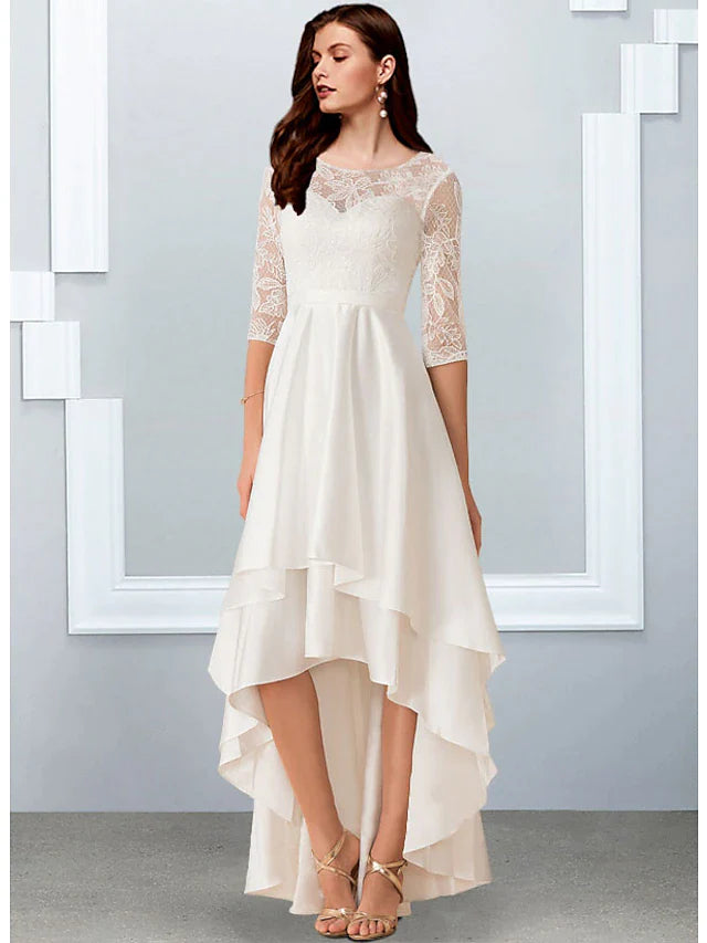 Close-up of the illusion neck and half sleeves on the white chiffon dress.