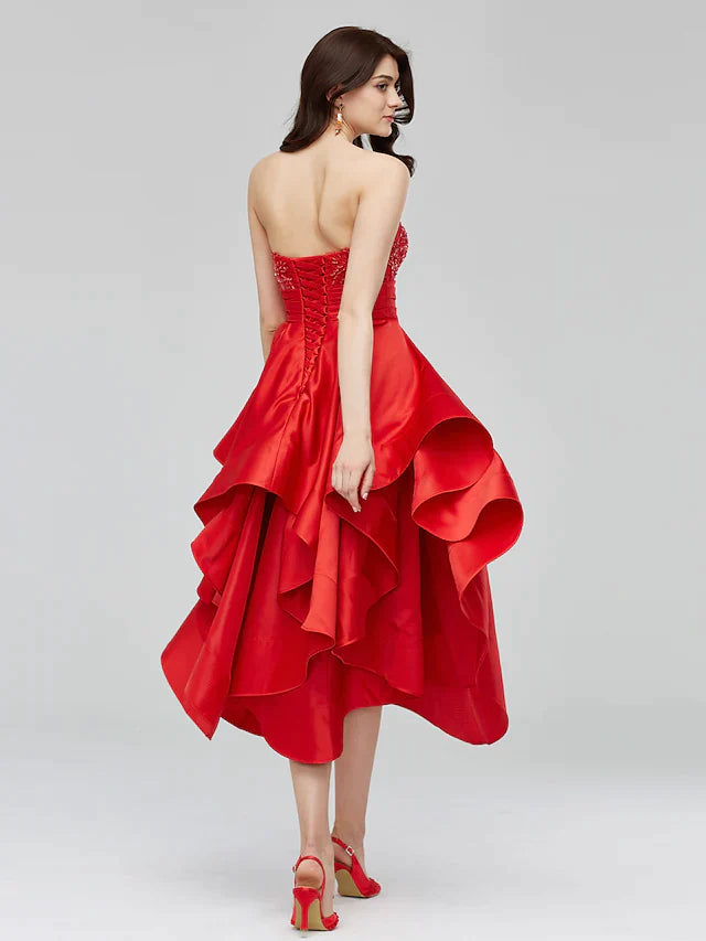 Back view of a blue A-Line fit and flare dress featuring an open back design.