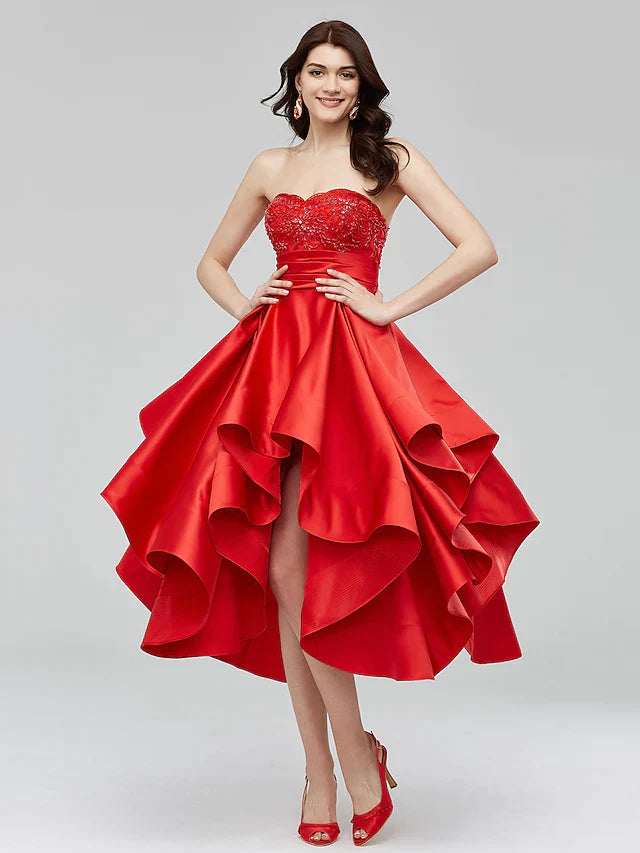 Side view of the blue A-Line dress, highlighting the asymmetrical hemline and satin fabric.