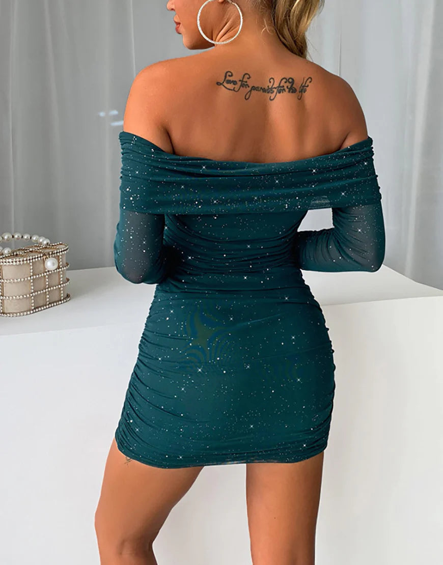 Woman posing in a dark green off-shoulder bodycon dress.