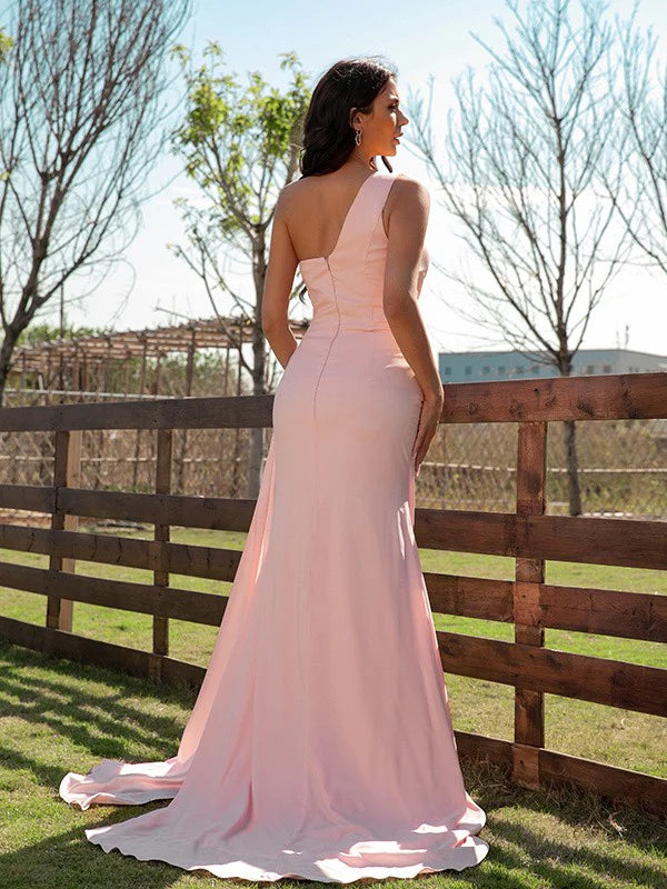 Back view of the pink one-shoulder long prom dress on a model.