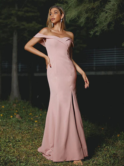 Model wearing a chic stretch crepe off-shoulder bridesmaid dress with ruffles.