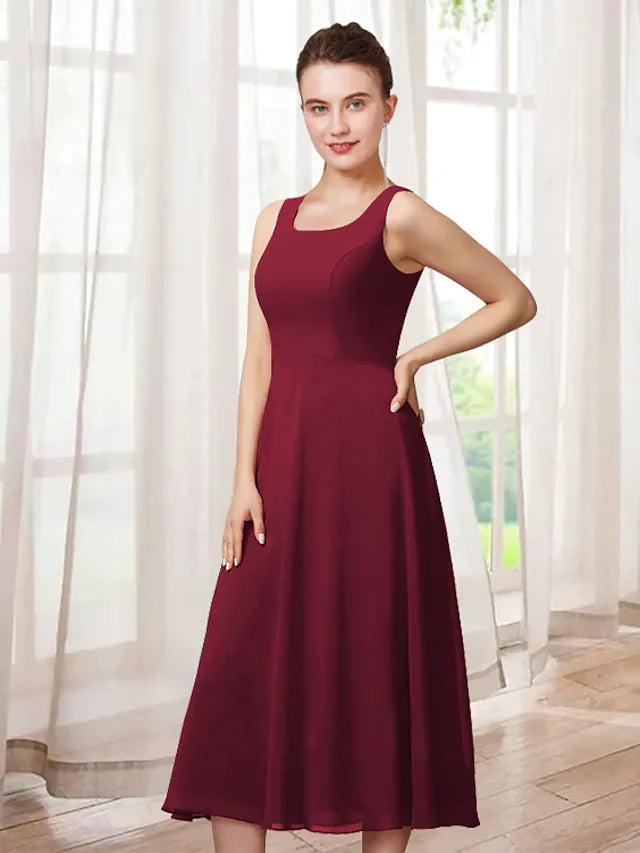 Elegant two-piece A-line Mother of the Bride dress with jewel neck and 3/4 sleeves.