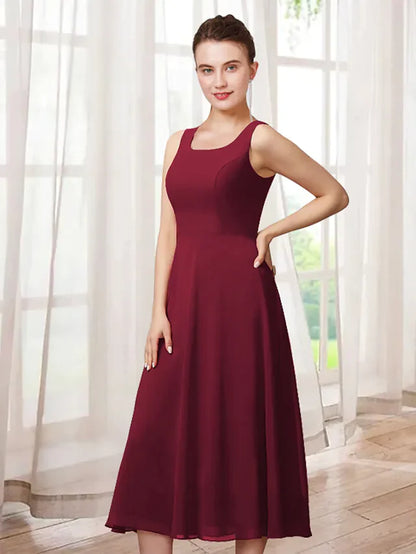 Elegant two-piece A-line Mother of the Bride dress with jewel neck and 3/4 sleeves.