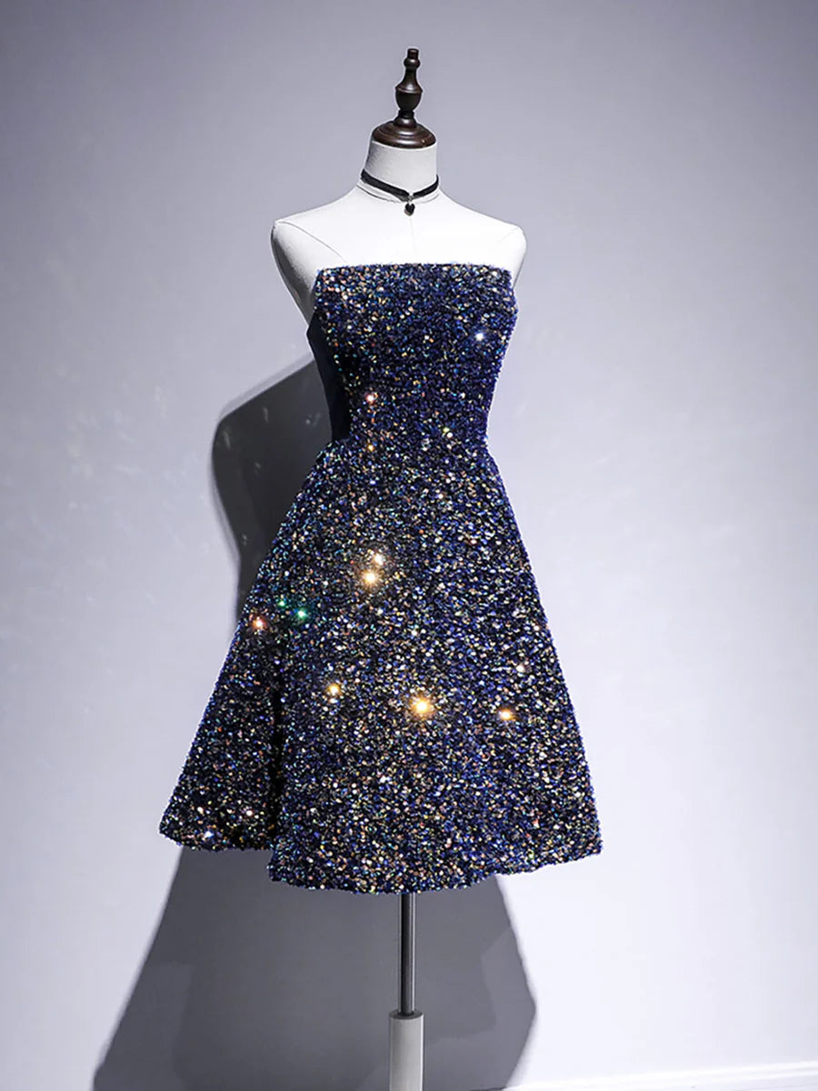 Close-up of the sequin detail on a blue A-line dress.