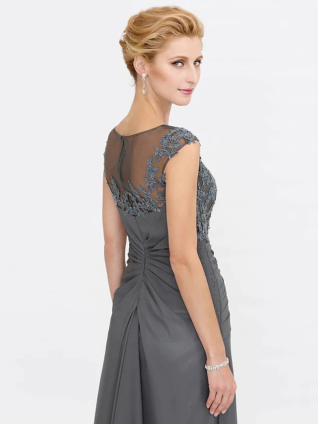 Close-up of bateau neck and see-through lace detail on elegant gown.