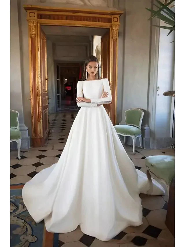 Elegant A-Line wedding dress with bateau neckline, long sleeves, and a flowing court train.