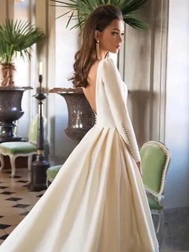 Back view of the A-Line wedding dress, featuring a simple backless design and long court train.
