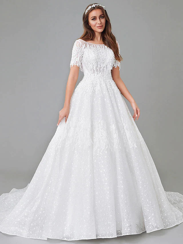Side profile of a bride wearing the A-Line wedding dress, highlighting its flowing silhouette.