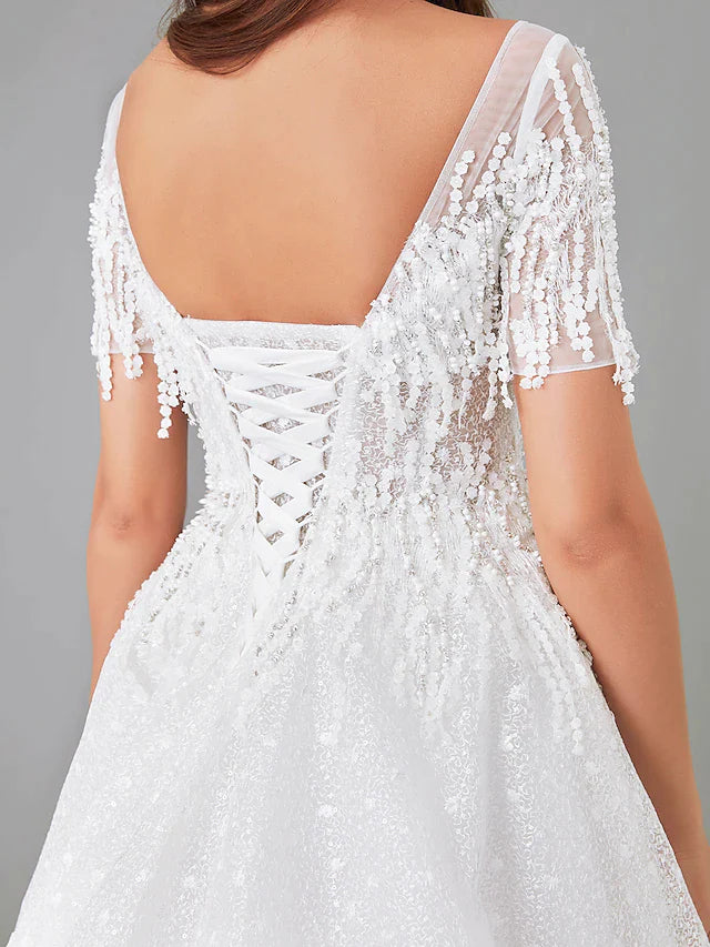 Full length view of the elegant A-Line wedding dress with its graceful skirt and train.