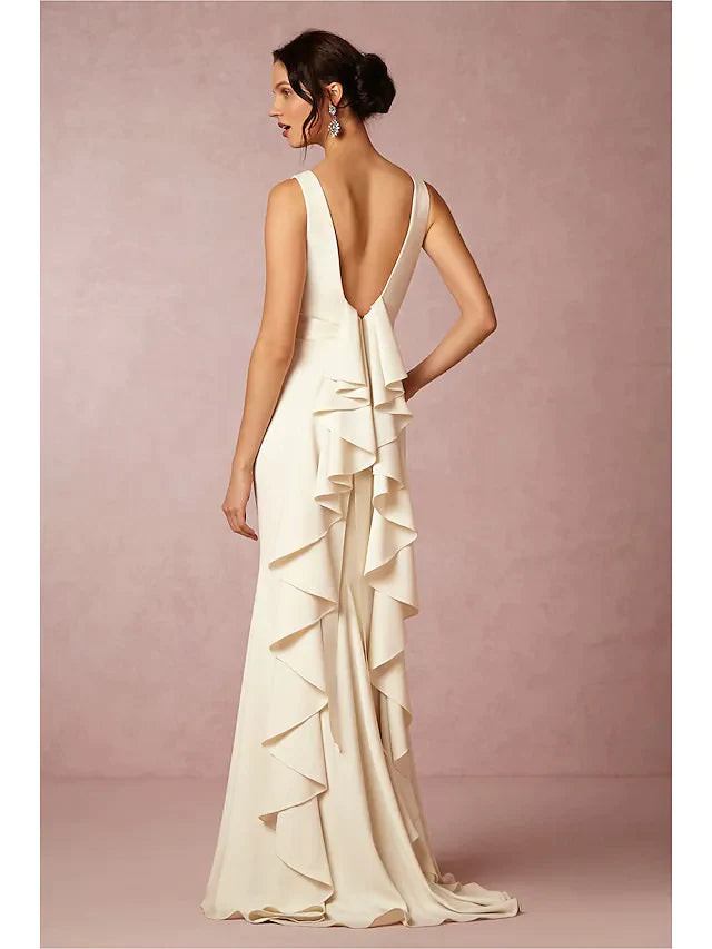 Back view of a white satin wedding dress, showing draped fabric and regular straps.