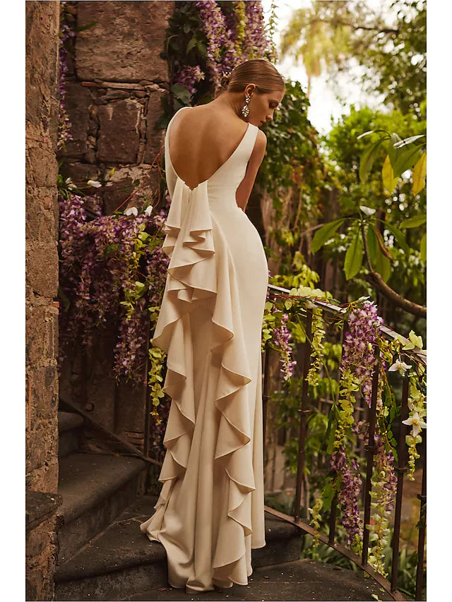 Front view of a white satin wedding dress featuring a bateau neckline and elegant draping.