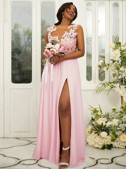 Woman wearing an elegant A-line chiffon bridesmaid dress with delicate applique and a scoop neckline.