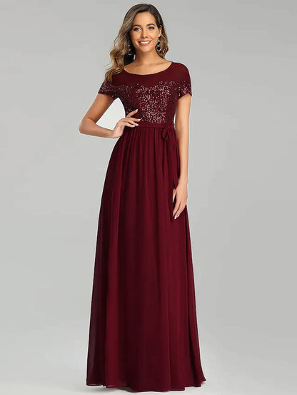 Back view of the floor-length light blue A-line chiffon dress, showcasing its elegant drape.