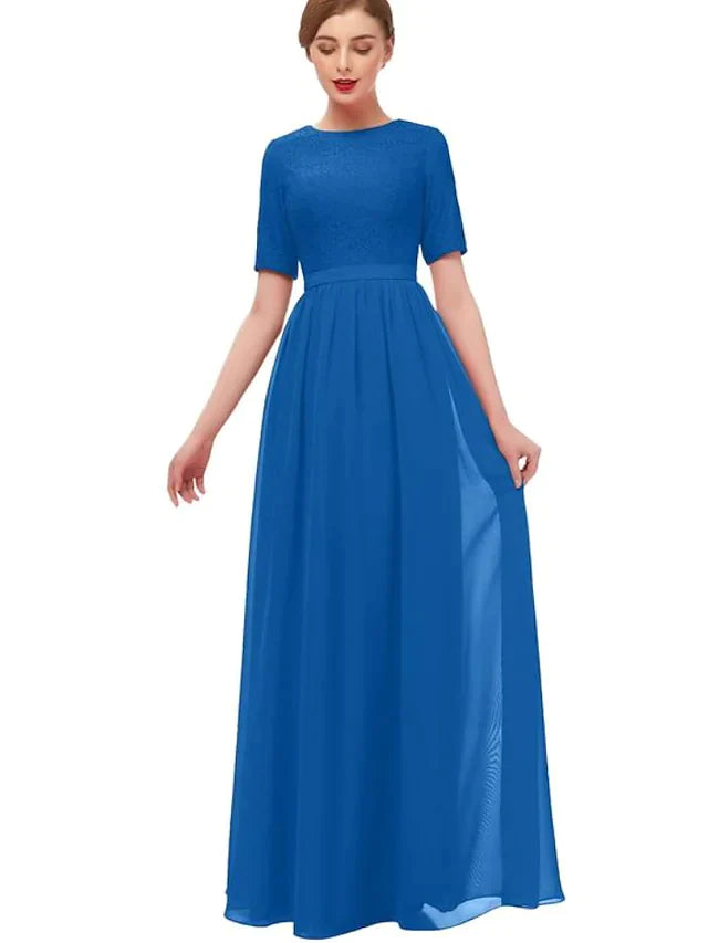 Woman wearing an elegant A-line floor-length chiffon bridesmaid dress with pleats and ruffles.
